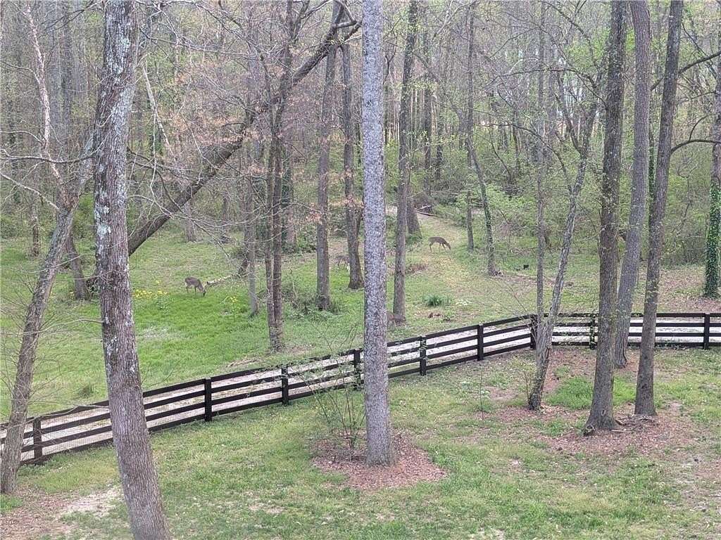 9.76 Acres of Land with Home for Sale in Lawrenceville, Georgia