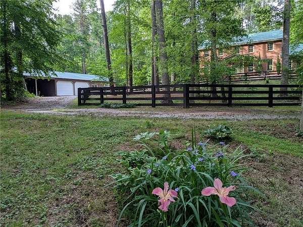 9.76 Acres of Land with Home for Sale in Lawrenceville, Georgia