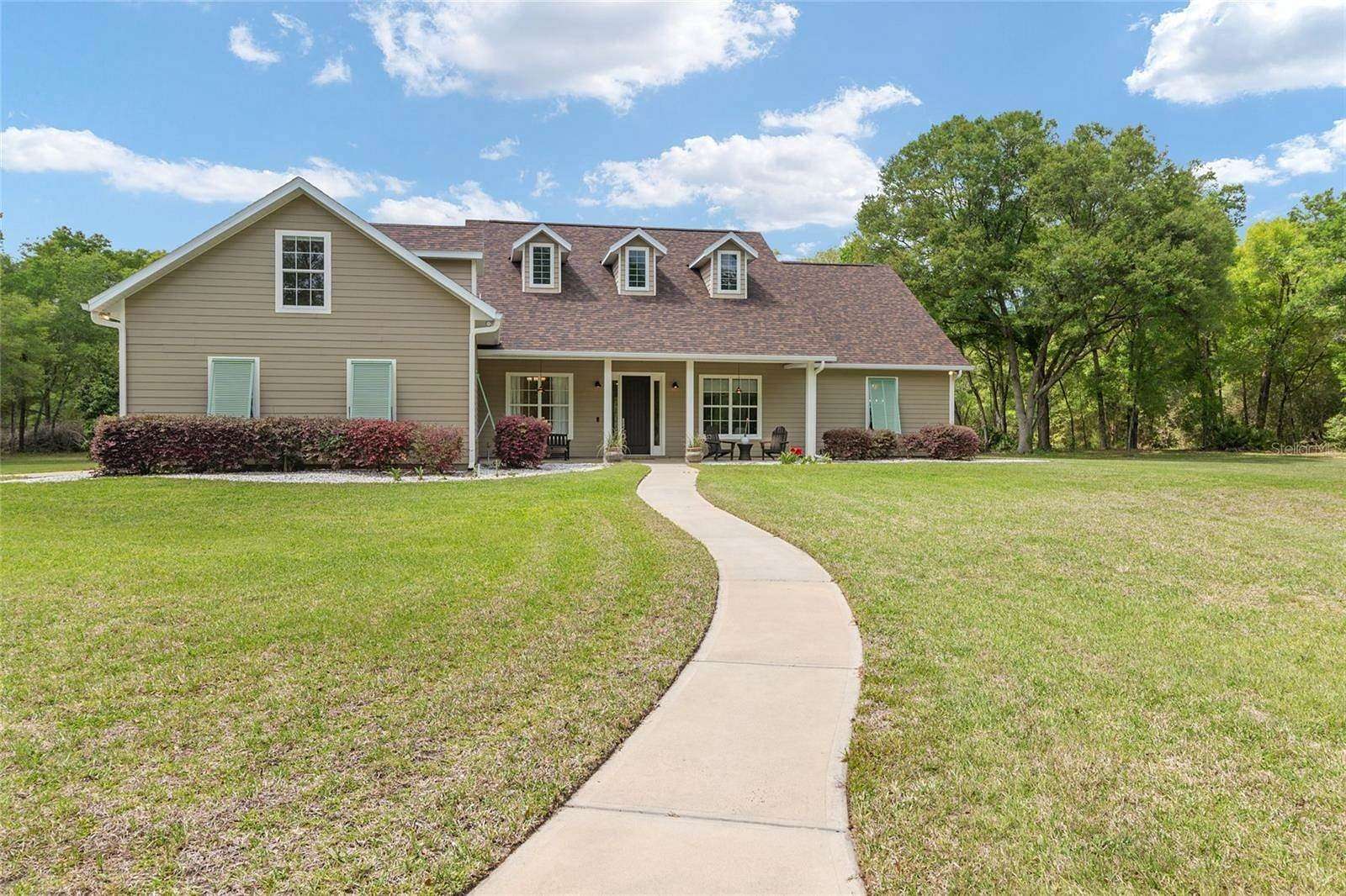 5.33 Acres of Land with Home for Sale in Newberry, Florida