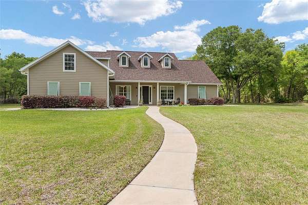 5.33 Acres of Land with Home for Sale in Newberry, Florida