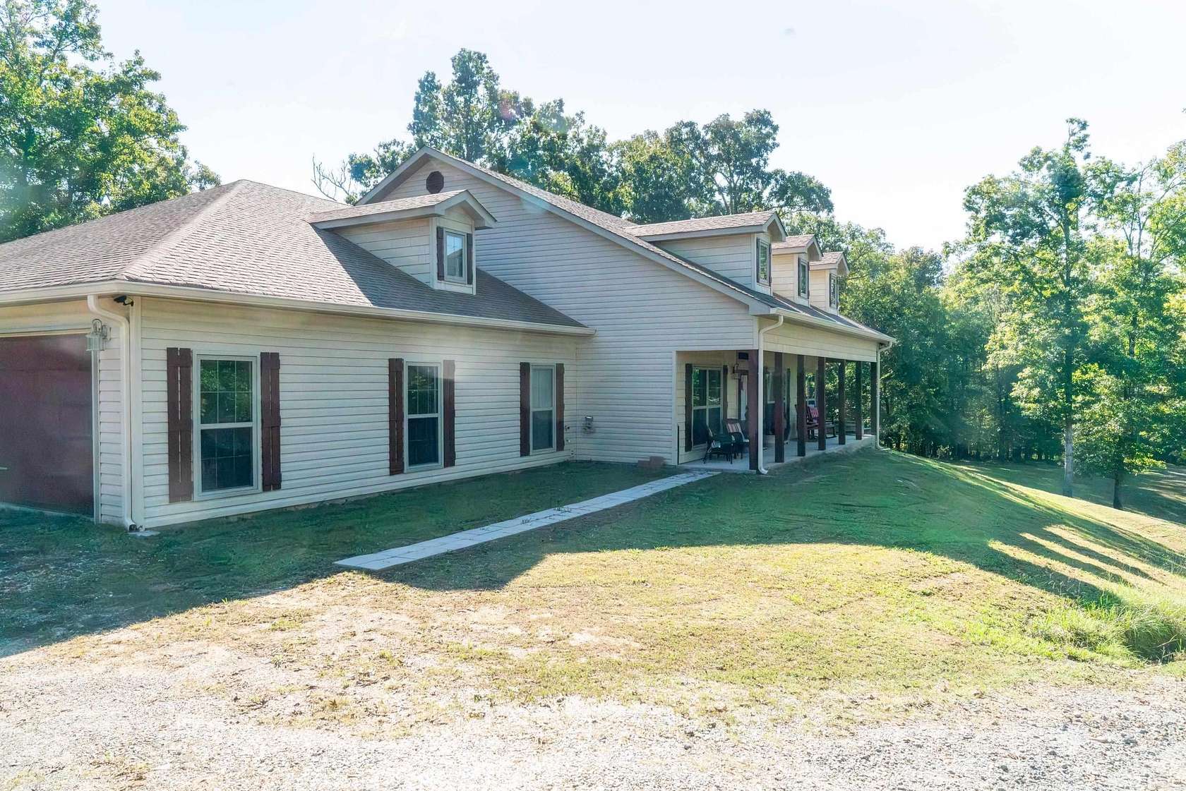 9.74 Acres of Land with Home for Sale in Benton, Arkansas