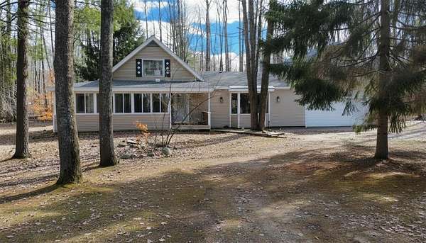 5 Acres of Land with Home for Sale in Harrison, Michigan