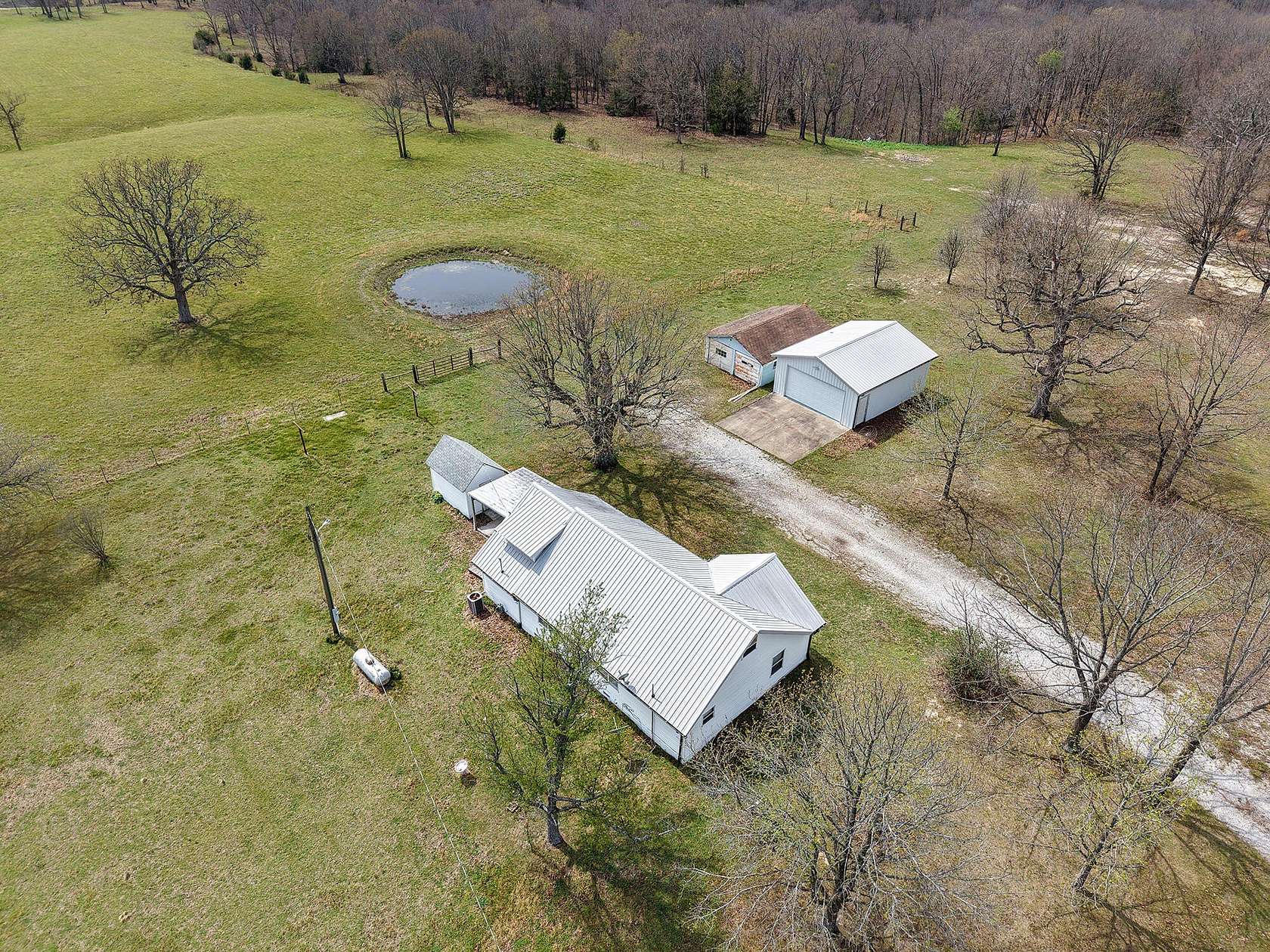 34.6 Acres of Recreational Land with Home for Sale in Aurora, Missouri