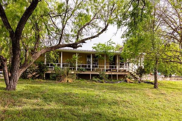 5.13 Acres of Land with Home for Lease in Center Point, Texas