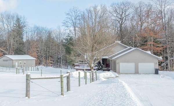 10 Acres of Land with Home for Sale in Stanwood, Michigan