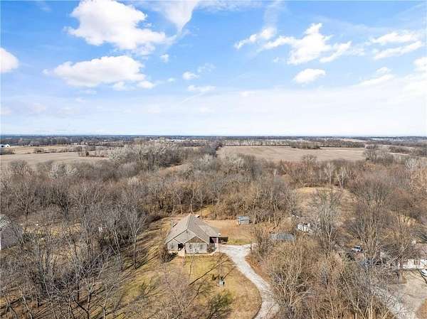 4.9 Acres of Land with Home for Sale in Belton, Missouri