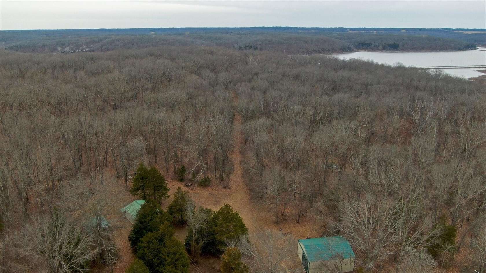 21.1 Acres of Recreational Land with Home for Sale in Osceola, Missouri