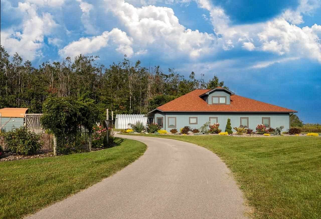 10 Acres of Land with Home for Sale in Charlevoix, Michigan