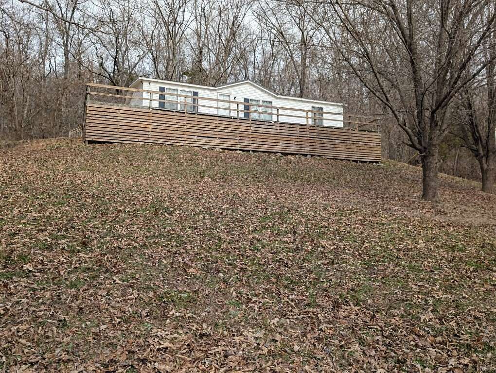 9.88 Acres of Land with Home for Sale in Alpena, Arkansas