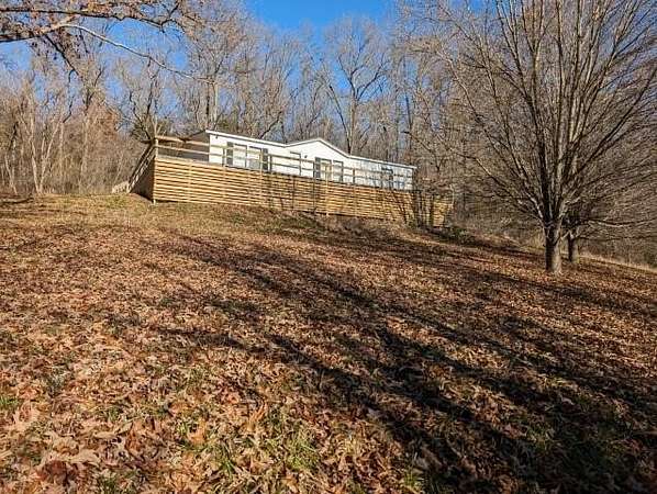 9.88 Acres of Land with Home for Sale in Alpena, Arkansas