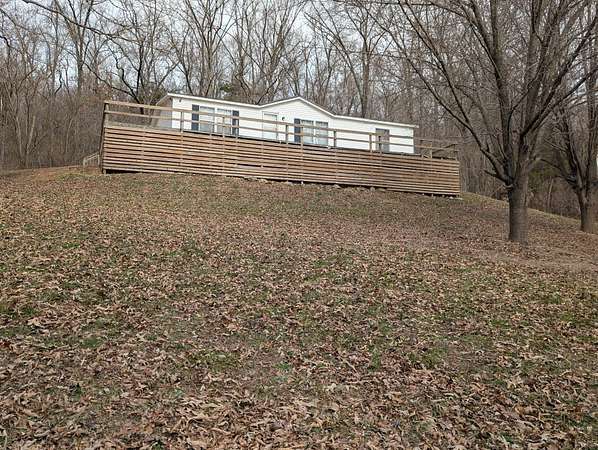 9.88 Acres of Land with Home for Sale in Alpena, Arkansas