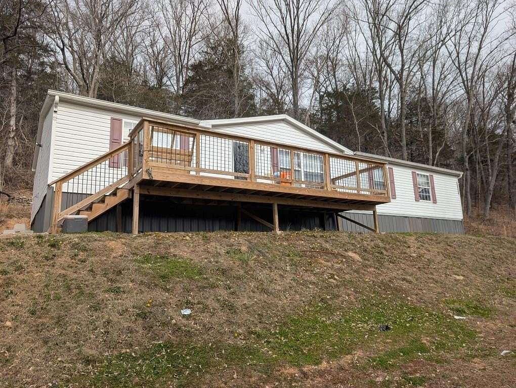 5 Acres of Land with Home for Sale in Alpena, Arkansas