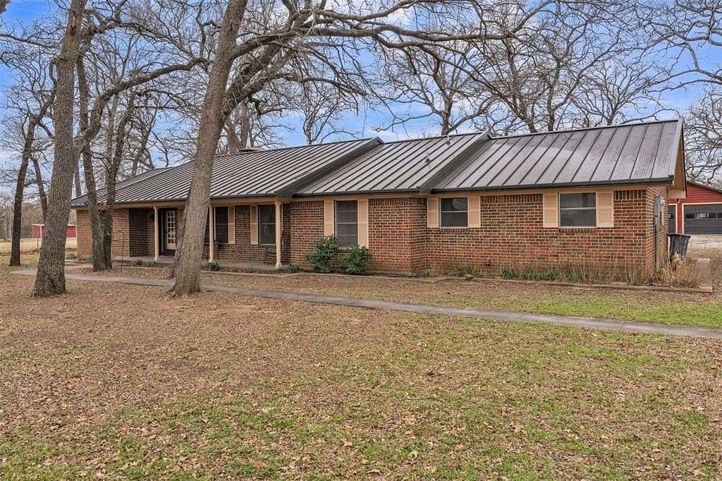 6.89 Acres of Land with Home for Sale in Grandview, Texas