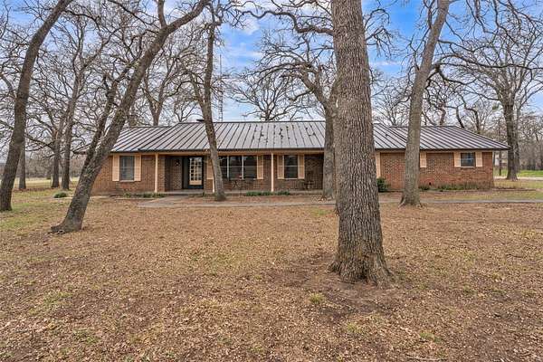 6.89 Acres of Land with Home for Sale in Grandview, Texas