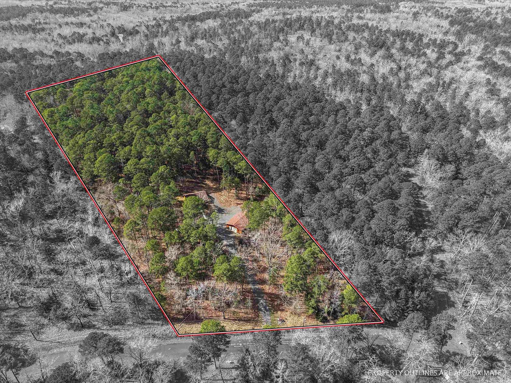 5.19 Acres of Land with Home for Sale in Avinger, Texas
