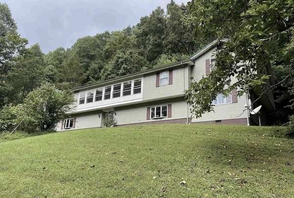 27.7 Acres of Land with Home for Sale in Crum, West Virginia