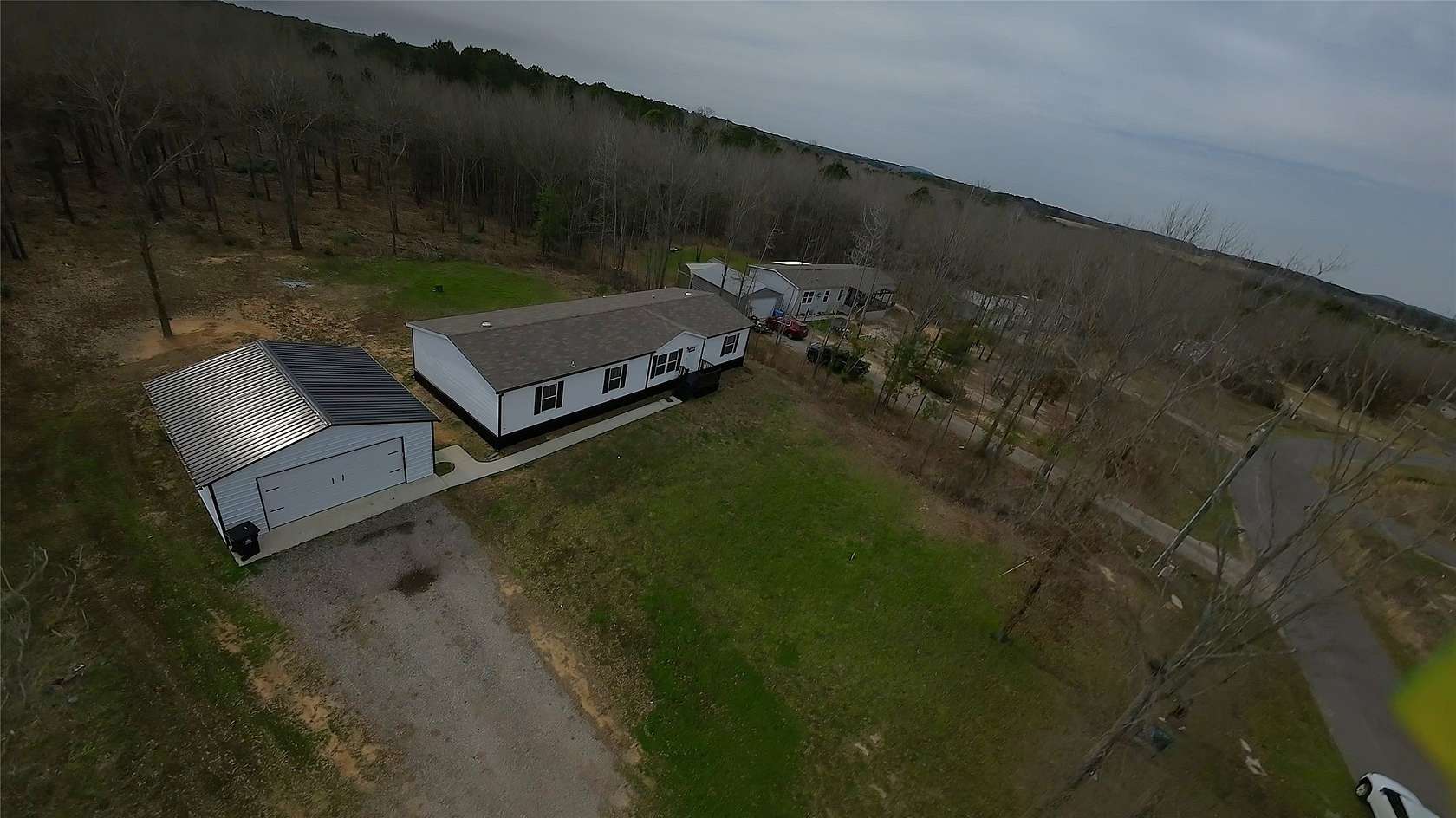 1.5 Acres of Land with Home for Sale in Gilmer, Texas