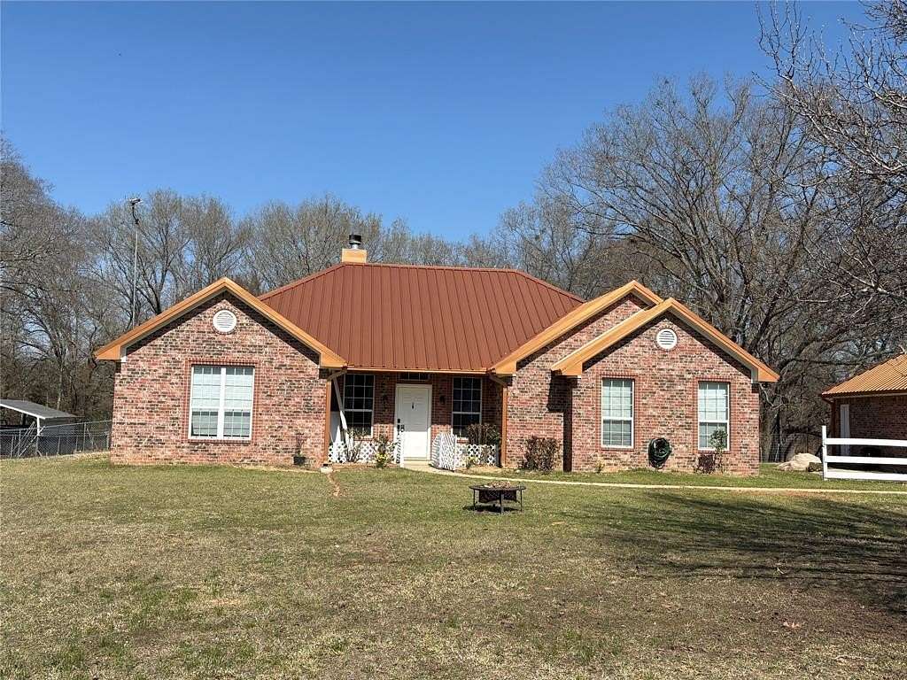 16.6 Acres of Recreational Land with Home for Sale in Omaha, Texas