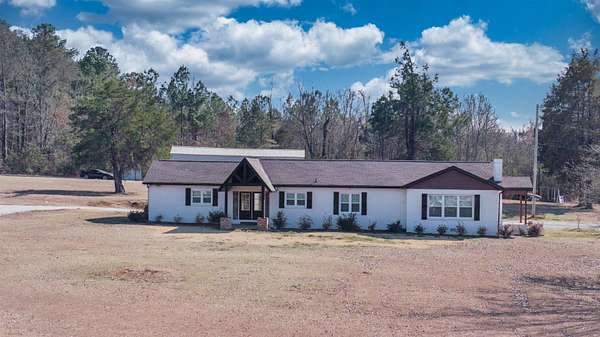 22.1 Acres of Land with Home for Sale in Muscle Shoals, Alabama