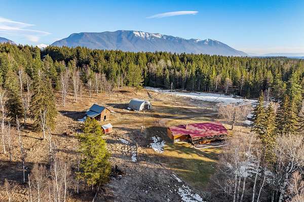 30 Acres of Agricultural Land with Home for Sale in Columbia Falls, Montana