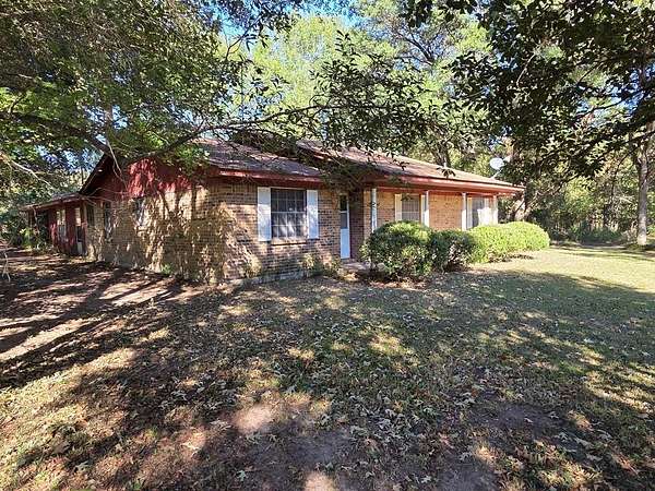 97.3 Acres of Recreational Land with Home for Sale in Huntington, Texas
