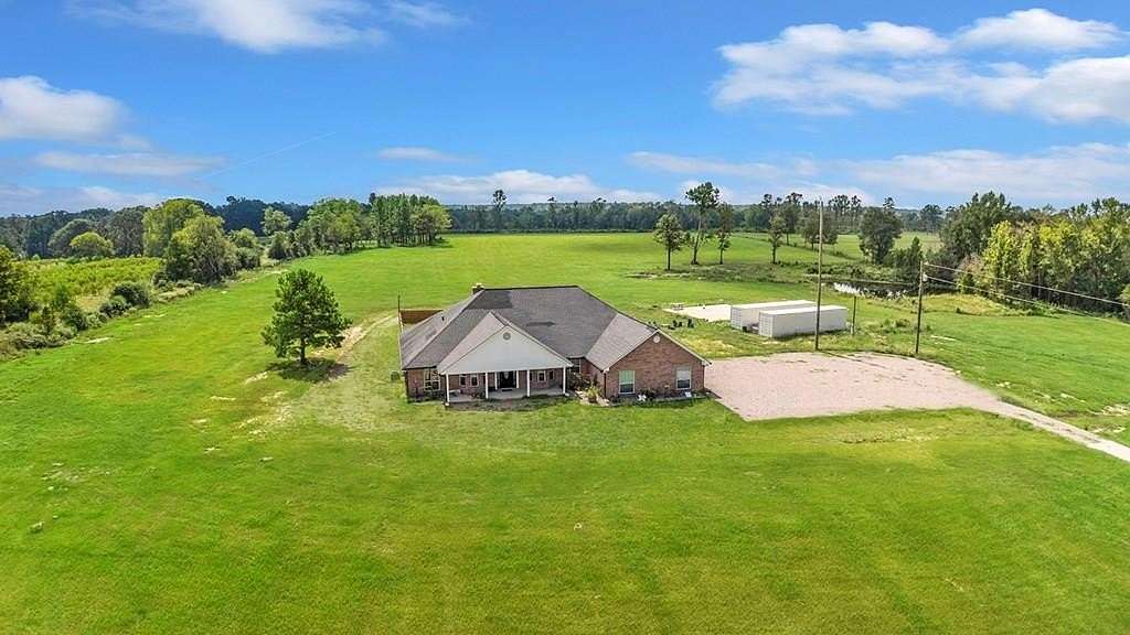 21 Acres of Agricultural Land with Home for Sale in Center, Texas