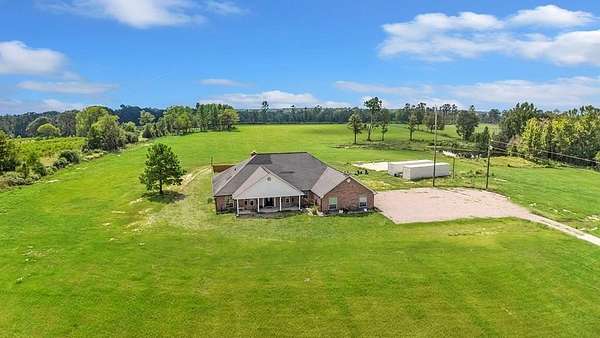 21 Acres of Agricultural Land with Home for Sale in Center, Texas