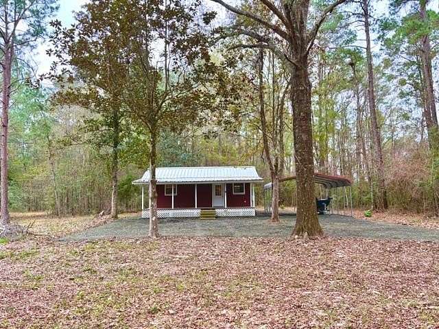 10.9 Acres of Recreational Land with Home for Sale in Woodville, Texas