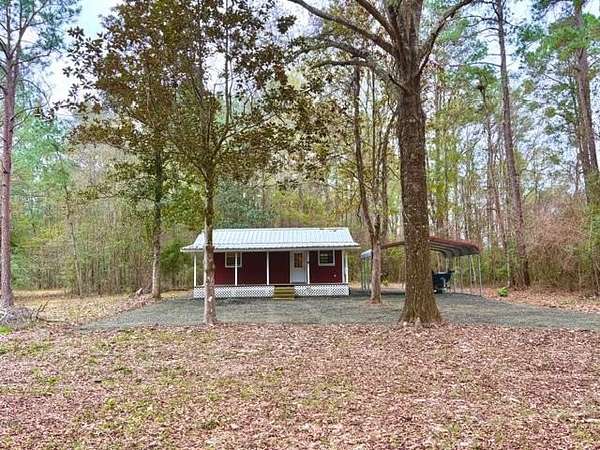 10.9 Acres of Recreational Land with Home for Sale in Woodville, Texas