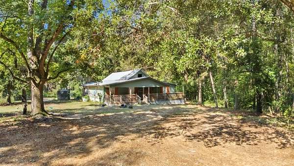 7.68 Acres of Land with Home for Sale in San Augustine, Texas