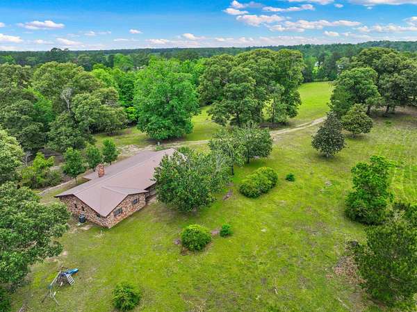 28.8 Acres of Recreational Land with Home for Sale in Kirbyville, Texas