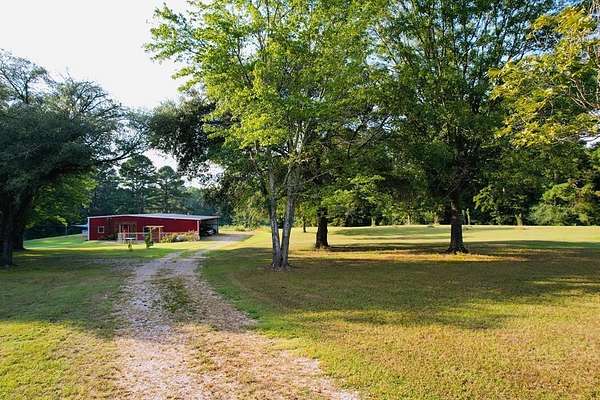 26 Acres of Agricultural Land with Home for Sale in Joaquin, Texas