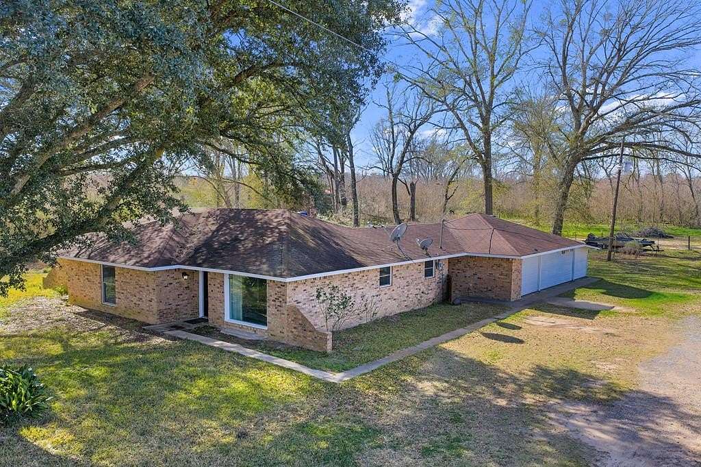 9.9 Acres of Land with Home for Sale in Timpson, Texas