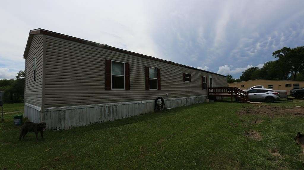 1.89 Acres of Land with Home for Sale in Dayton, Texas