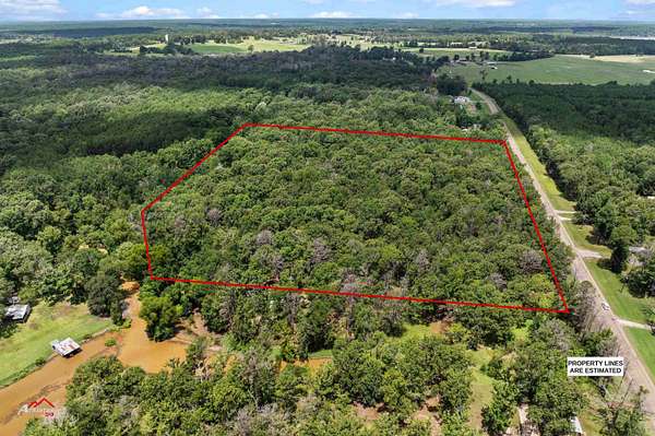 8.67 Acres of Land with Home for Sale in Shelbyville, Texas