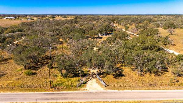 10.5 Acres of Recreational Land with Home for Sale in Devine, Texas