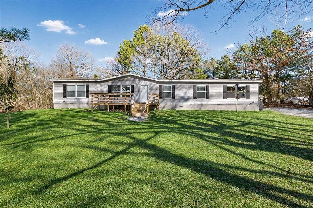 6.34 Acres of Land with Home for Sale in Lowell, Arkansas