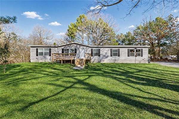 6.34 Acres of Land with Home for Sale in Lowell, Arkansas