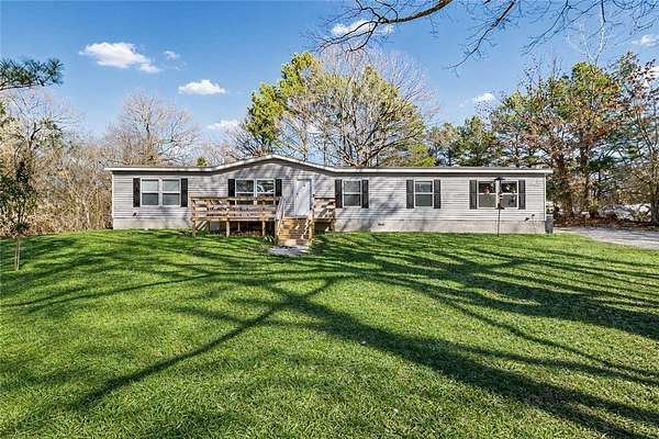 6.34 Acres of Land with Home for Sale in Lowell, Arkansas