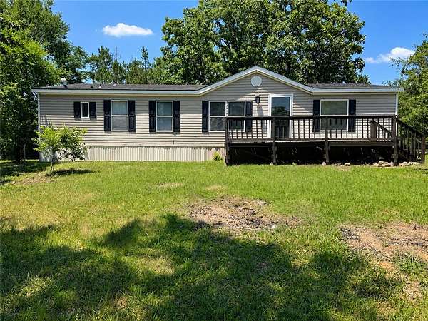 4.9 Acres of Land with Home for Sale in Ola, Arkansas