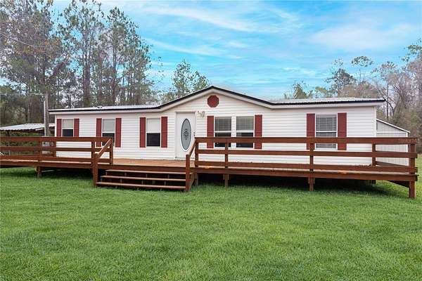 22.5 Acres of Agricultural Land with Home for Sale in Waldo, Florida