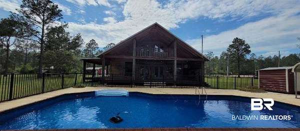 5 Acres of Land with Home for Sale in Robertsdale, Alabama