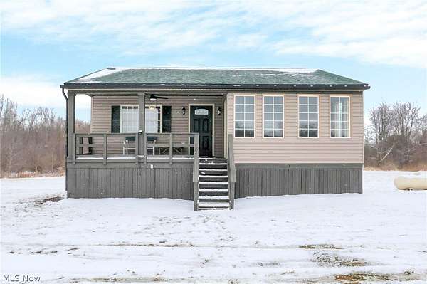 6.63 Acres of Land with Home for Sale in Lore City, Ohio