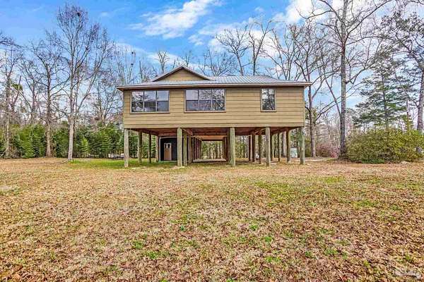 6.8 Acres of Land with Home for Sale in Molino, Florida