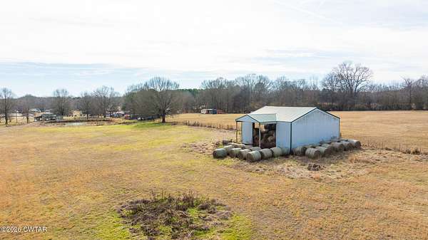 12.5 Acres of Land with Home for Sale in Gleason, Tennessee