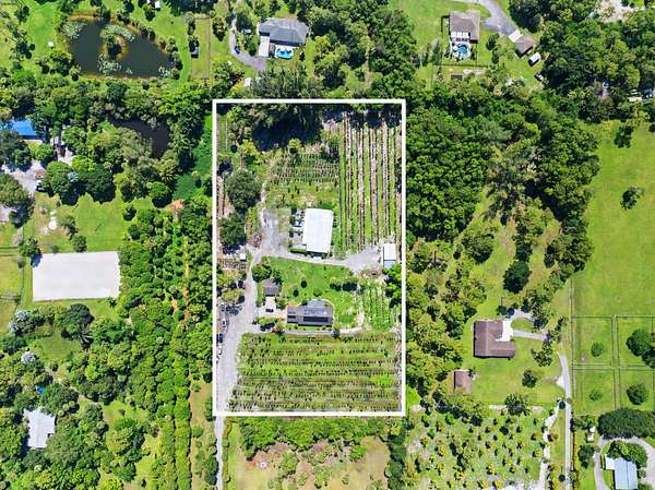 5.74 Acres of Land with Home for Sale in Loxahatchee Groves, Florida