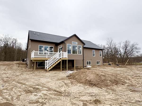 2.5 Acres of Land with Home for Sale in Alto, Michigan