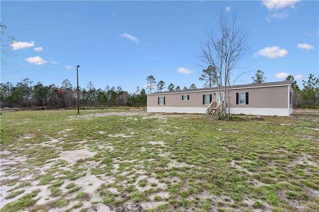6.75 Acres of Land with Home for Sale in Jesup, Georgia