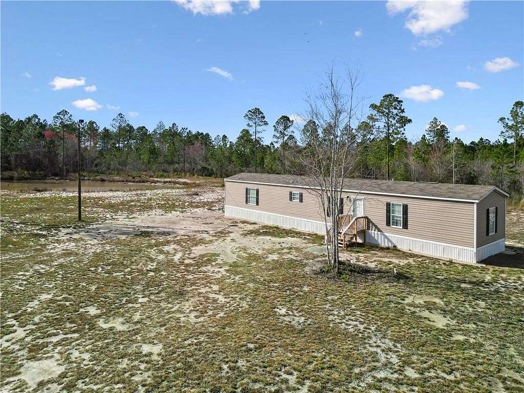 6.75 Acres of Land with Home for Sale in Jesup, Georgia