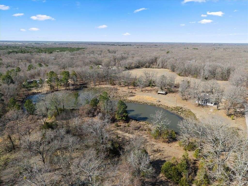 14.1 Acres of Land with Home for Sale in Mount Pleasant, Texas